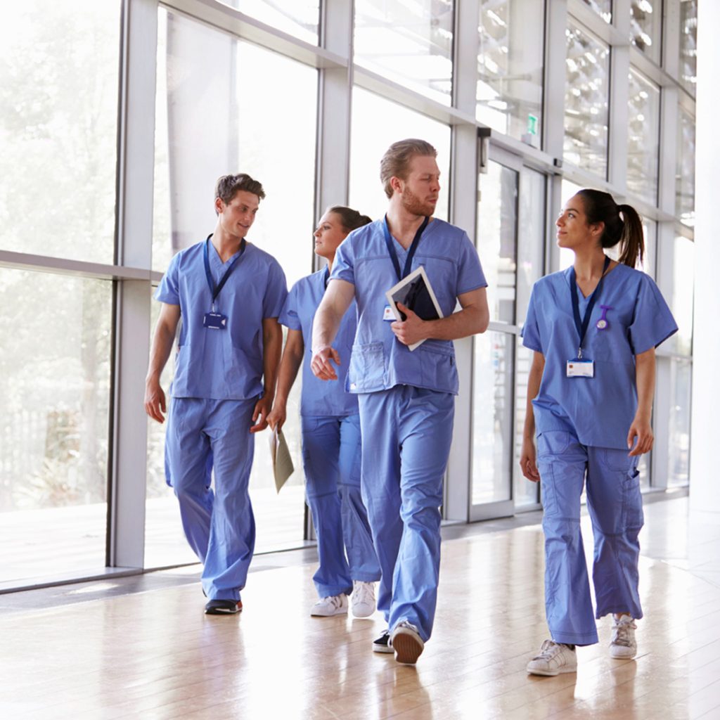 Featured image of a group of nurses walking down a corridor.