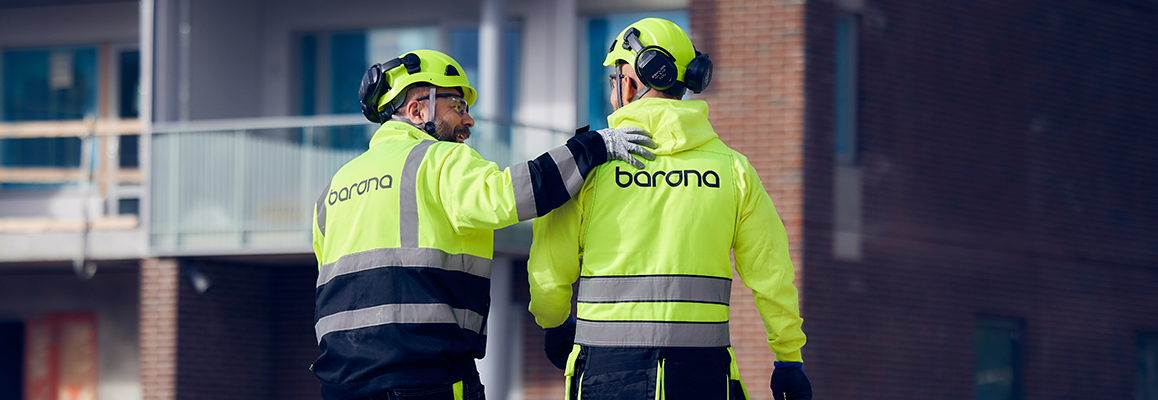 Decorative image of two Barona employees working on a construction site.